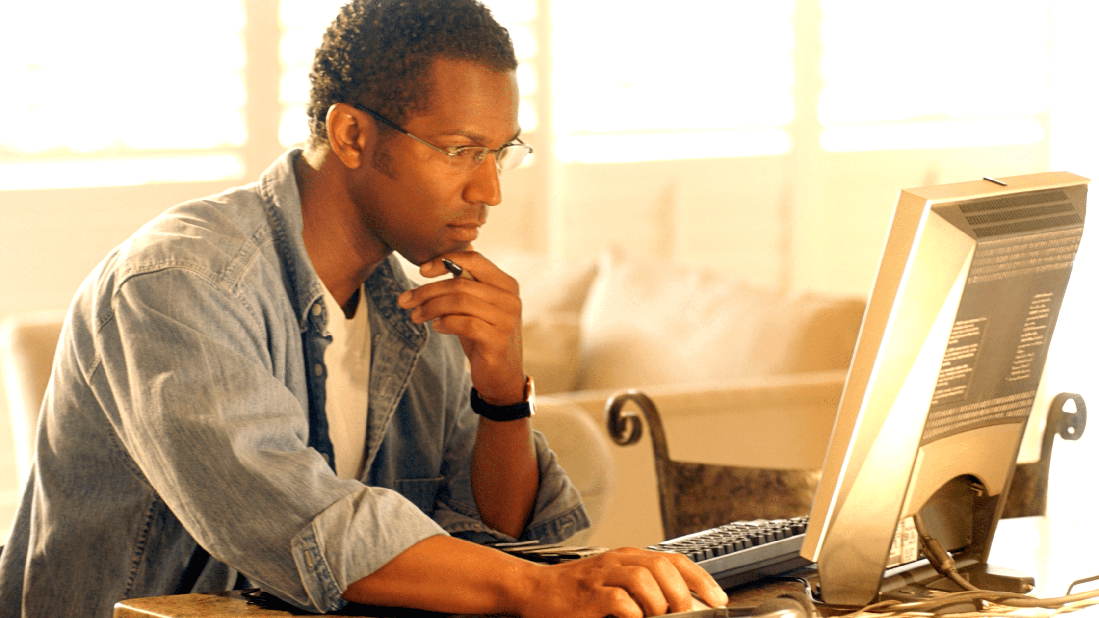 A pre-med student taking an MCAT practice exam on a computer.